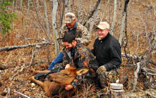 group posing with elk