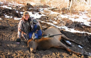 woman posing with elk
