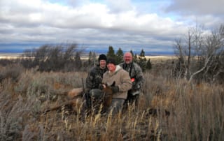 group posing with elk