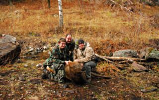 group posing with elk