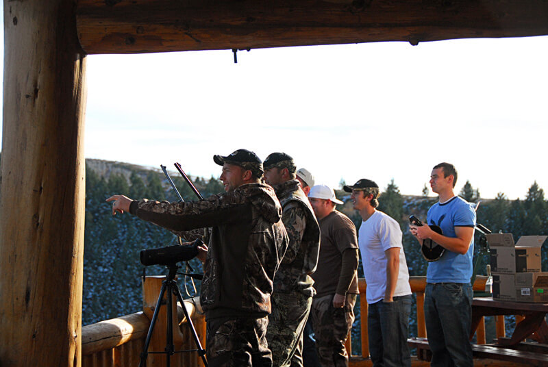 group of men at lodge pointing to someting on the groups