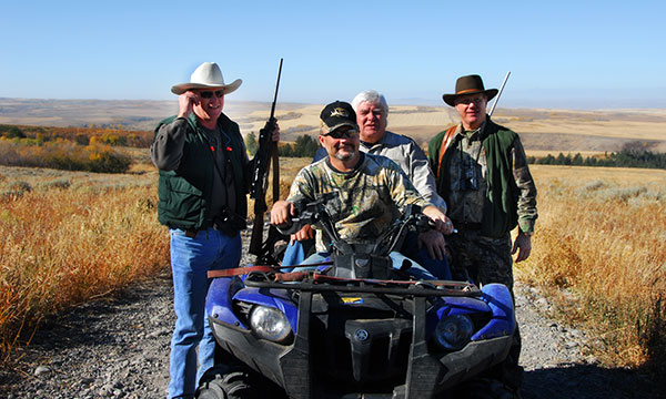 group posing on ATV