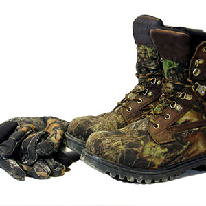 stock photo of camouflage boots and gloves