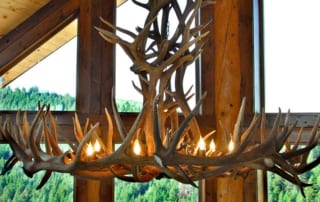 antler chandelier with lights on