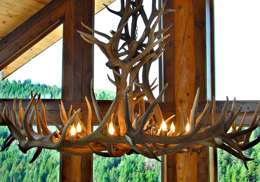 antler chandelier with lights on