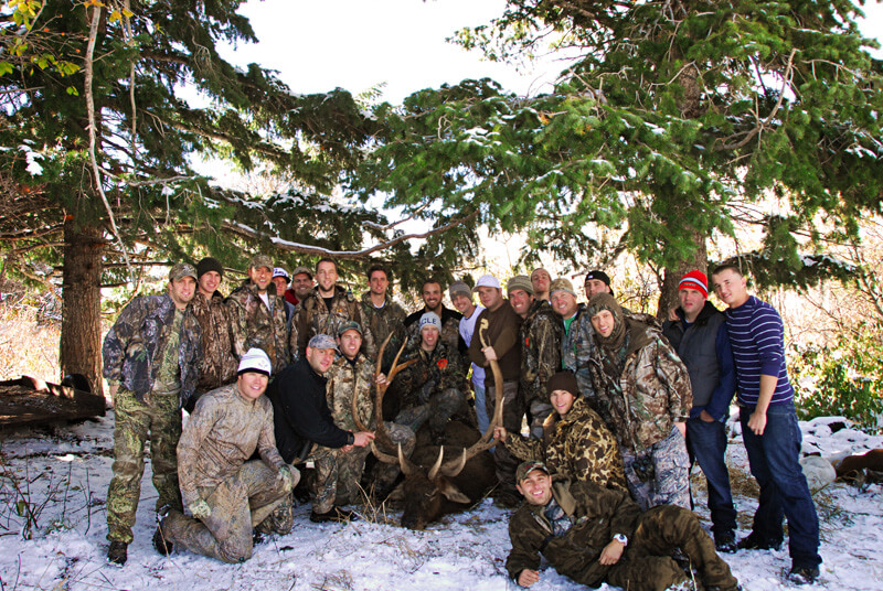 group photo with large elk and horns