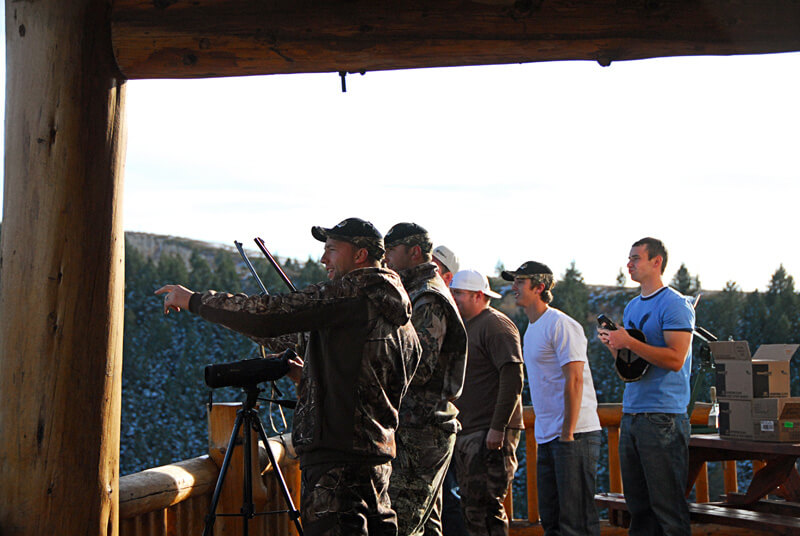 men pointing to something on the property