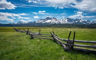 A majestic mountain rests in the background of an Idaho plateau.