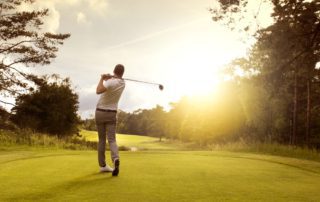 A man playing golf at one of the top courses in Idaho